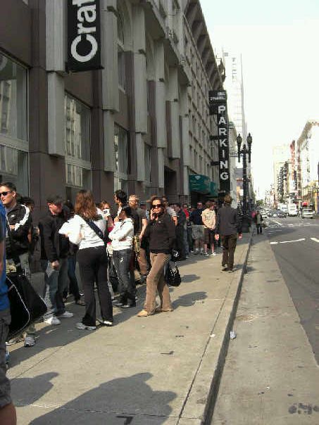 Line of customers outside the Apple store in downtown San Francisco Line of customers outside the Apple store in downtown San Francisco