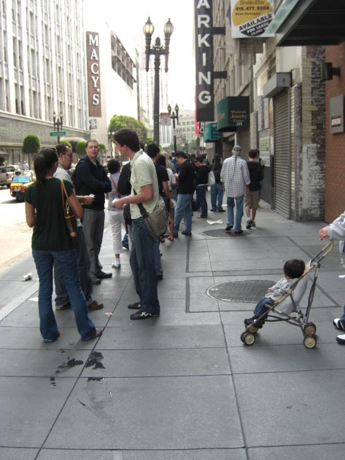 Line of customers outside the Apple Store in downtown San Francisco Line of customers outside the Apple Store in downtown San Francisco