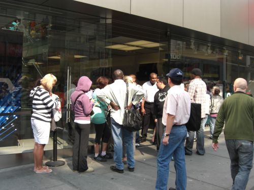 Line of customers outside the Apple Store in downtown San Francisco Line of customers outside the Apple Store in downtown San Francisco