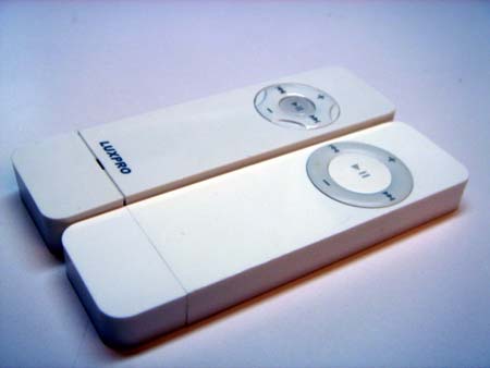 Luxpro Super Tangent (nee Super Shuffle) next to a first-gen iPod Shuffle Luxpro Super Tangent (nee Super Shuffle) next to a first-gen iPod Shuffle