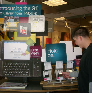 A shopper at a T-Mobile store in New York City on launch day for the G1 Android phone. A shopper at a T-Mobile store in New York City on launch day for the G1 Android phone.