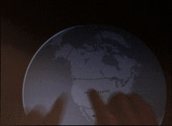 An example multitouch application where the user's hands 'handle' an on-screen globe. An example multitouch application where the user's hands 'handle' an on-screen globe.