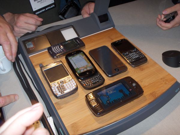 An unfair fight is in the works, as a gang of Palms led by the new Pre prepare to beat up Angela's poor BlackBerry Pearl.