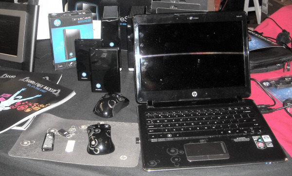 HP laptop shown with SimpleSave external backup attached