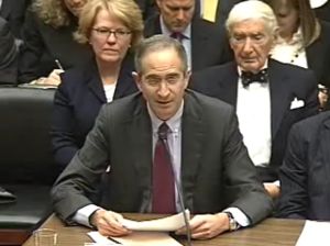 Comcast CEO Brian Roberts, flanked by his father (right), company founder Ralph Roberts.